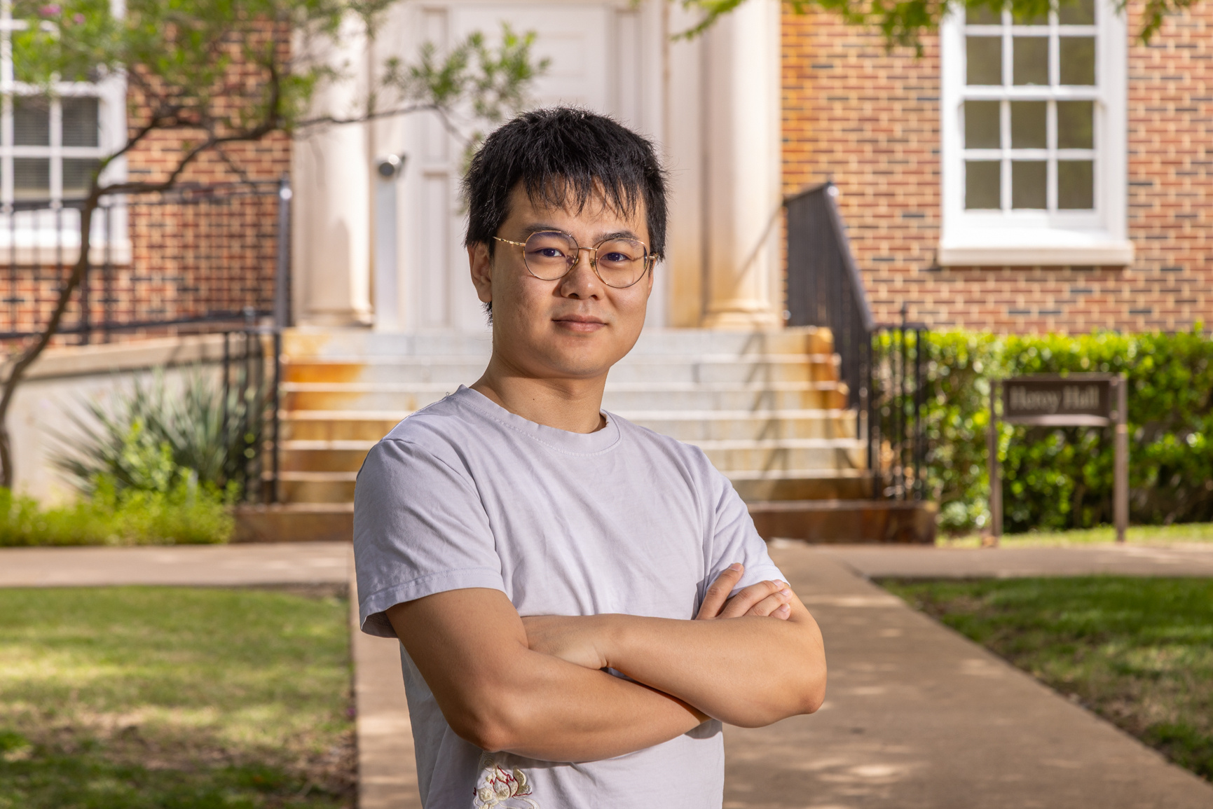 Postdoctoral student Qingyu Sui stands outside N.L. Heroy Hall, for use in a news release about his research on rock glaciers. Series produced for Southern Methodist University news release and social media, 2026.