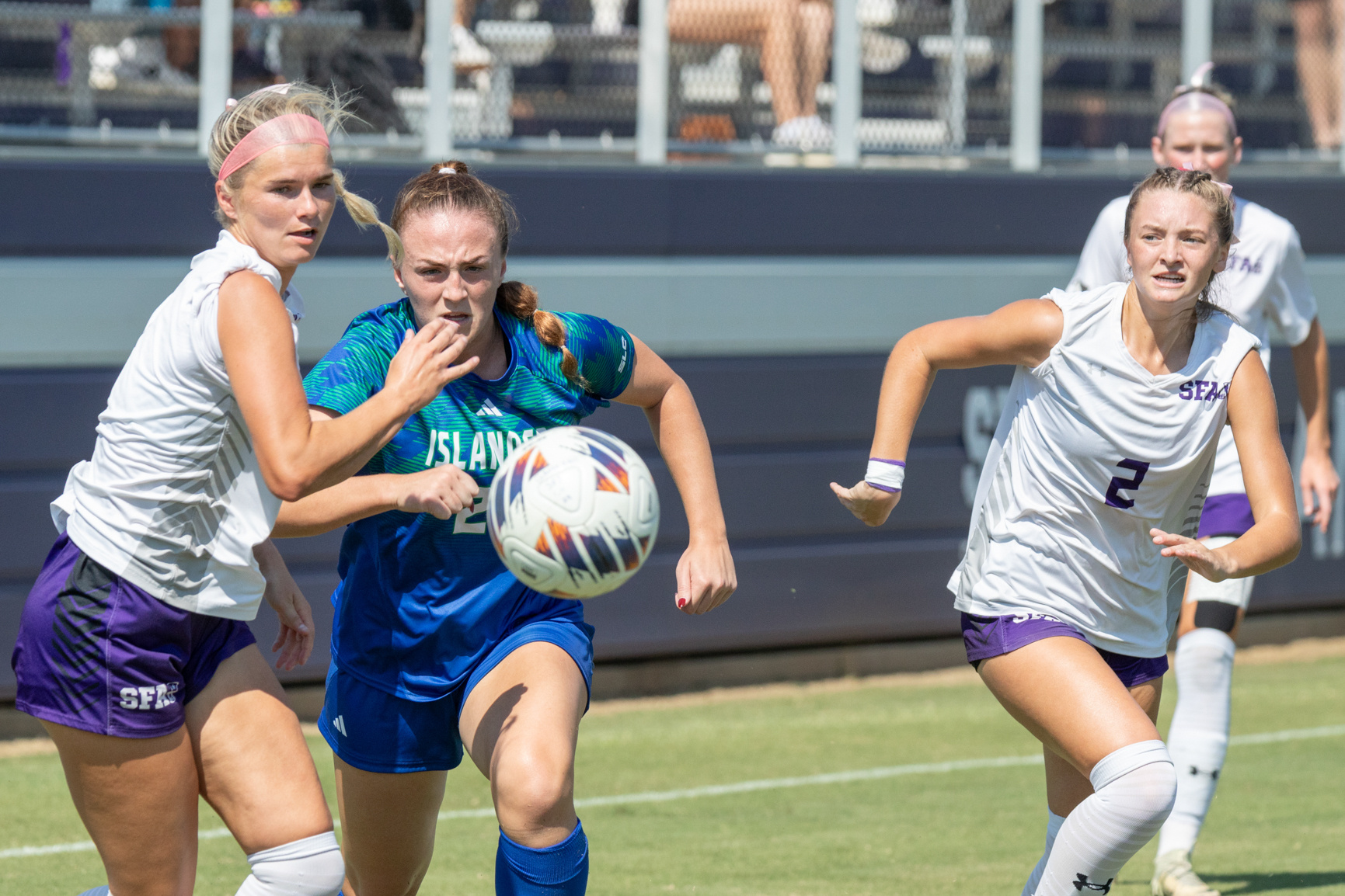 SFA graduate defender Hadley Williams and Texas A&M-Corpus Christi senior forward Megan Guy fight for control of the ball during the first half. SFA won against Texas A&M-Corpus Christi 7-0, pushing SFA to first place in the Southland Conference on Oct. 13